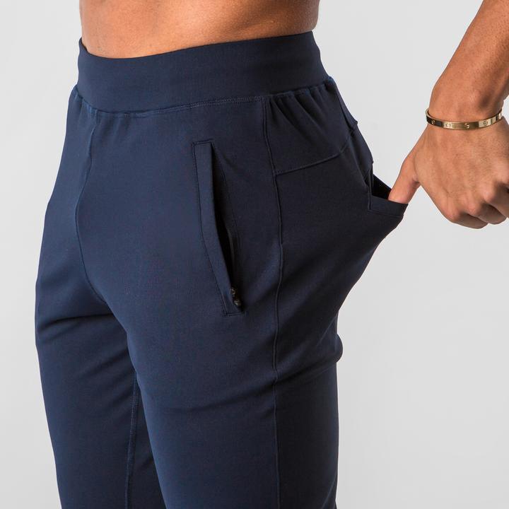 Men's sports trousers in dark blue, elastic waistband with side zip pocket