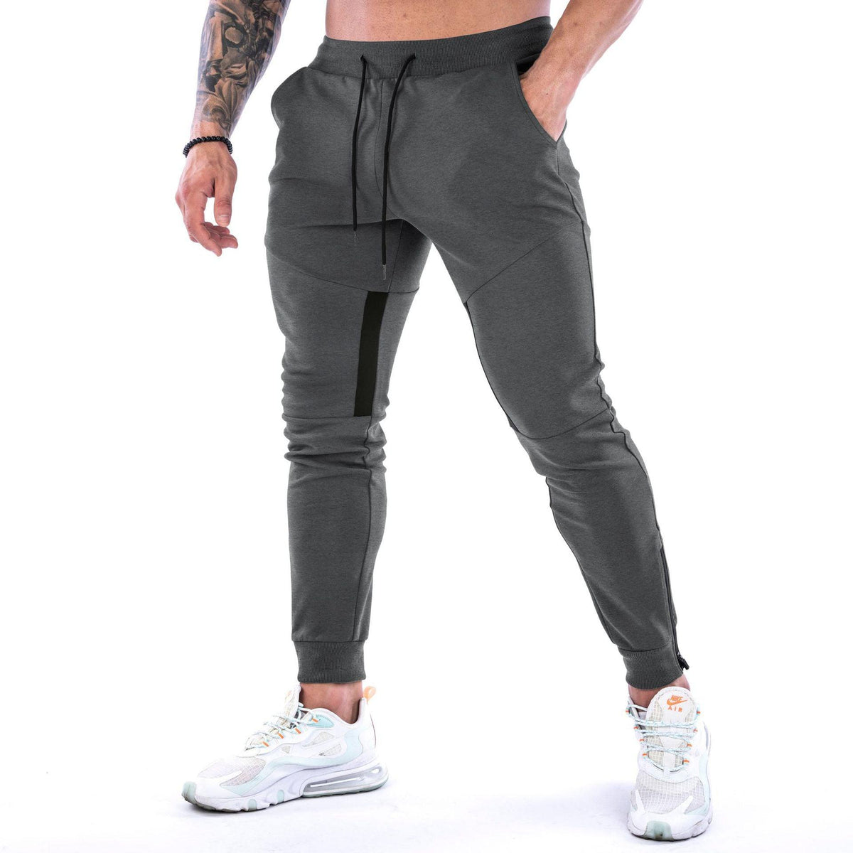 Men's fitness trousers in dark grey, drawstring waist, cuffed jogger hems
