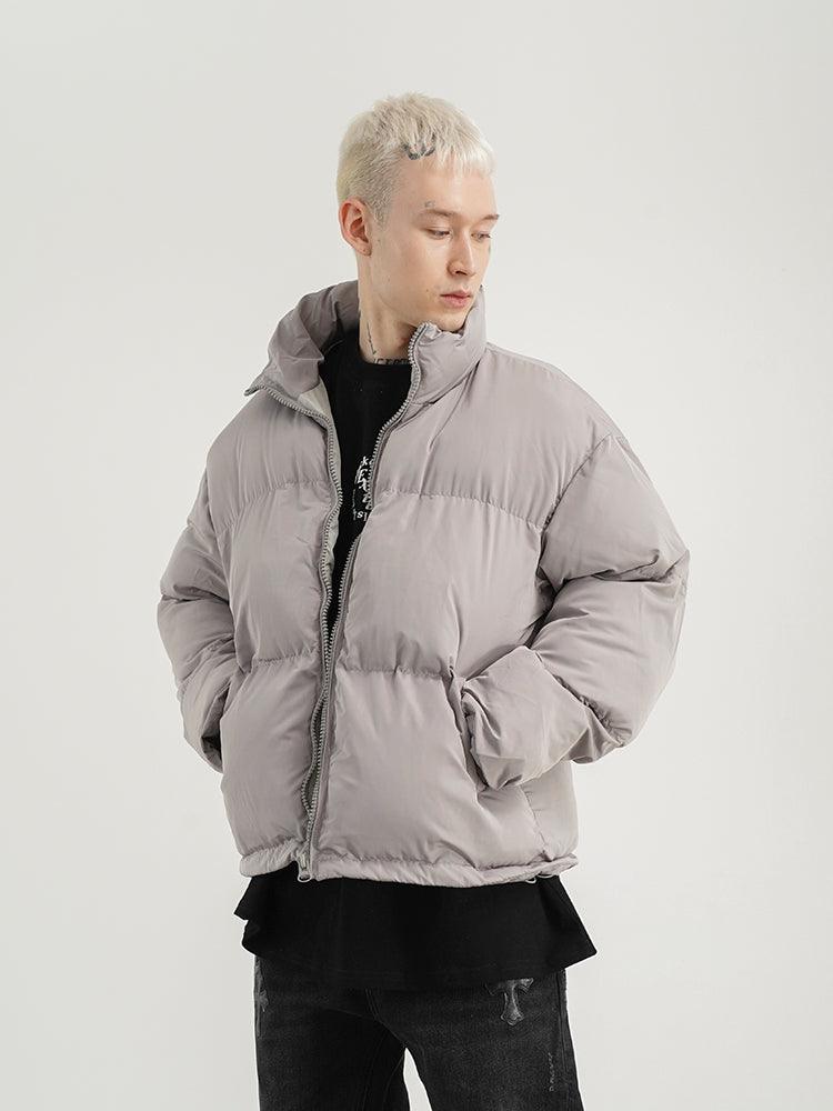 Light grey padded jacket with stand-up collar and full front zipper