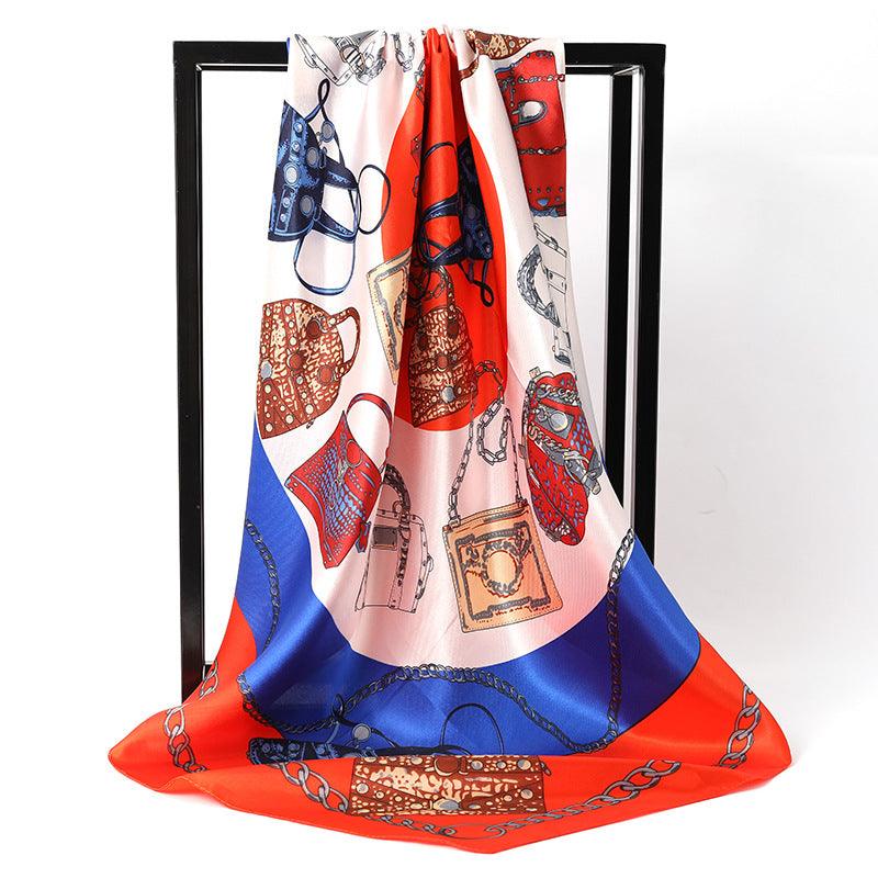 Women's silk scarf in white, blue, and red with chain and jewelry pattern