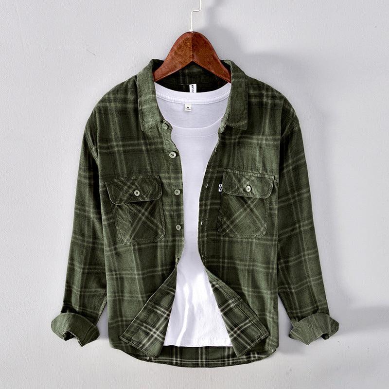 Men's dark green plaid long-sleeve button shirt with chest pockets and pointed collar