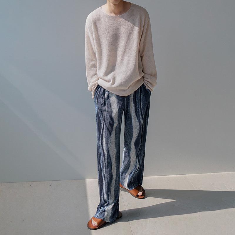 Beige long-sleeve T-shirt on model, loose fit, crew neck