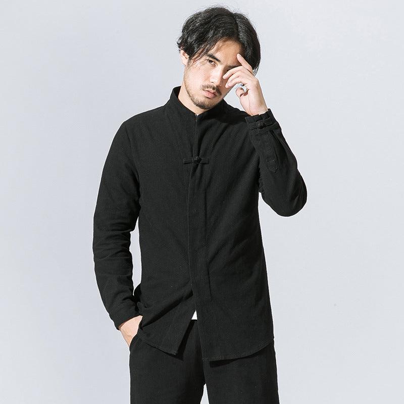 Black long-sleeve button-up shirt with stand collar and side-slit hem detail.