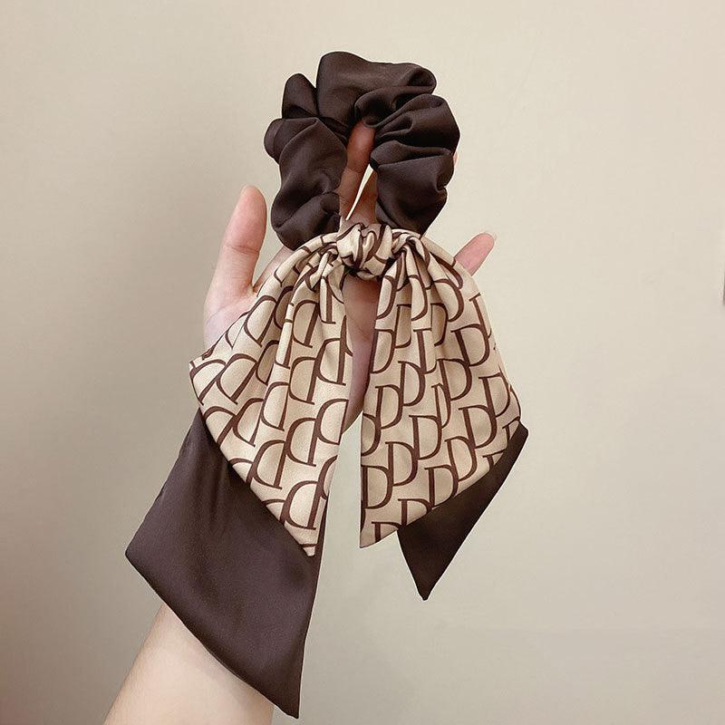 Satin hair headband with tied bow, brown scarf with beige pattern and matching scrunchie