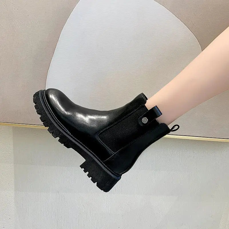Black leather-look Martin boots with strap at ankle and platform lug sole