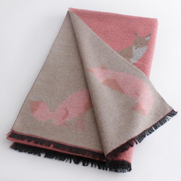 Thick warm jacquard scarf in beige and pink with fox silhouettes, fringed ends