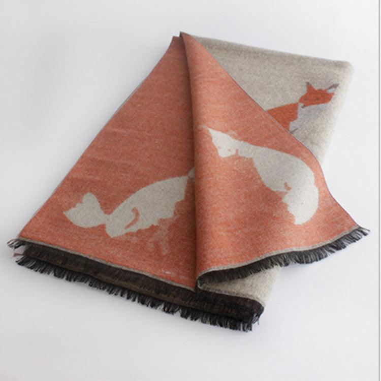 Thick warm jacquard scarf in rust and beige with fox silhouettes, fringed ends