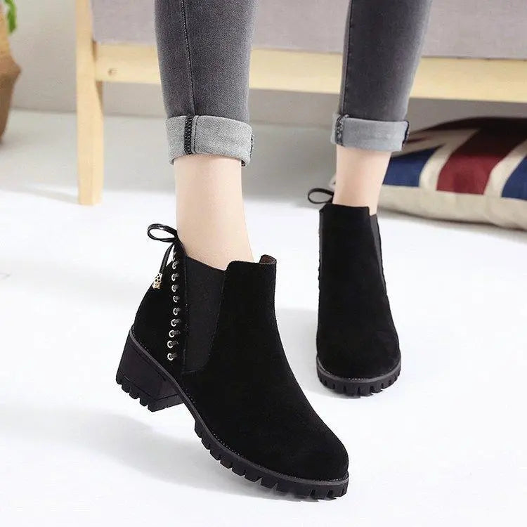 Black suede ankle boots with chunky block heel, side lace-up, and pull tab
