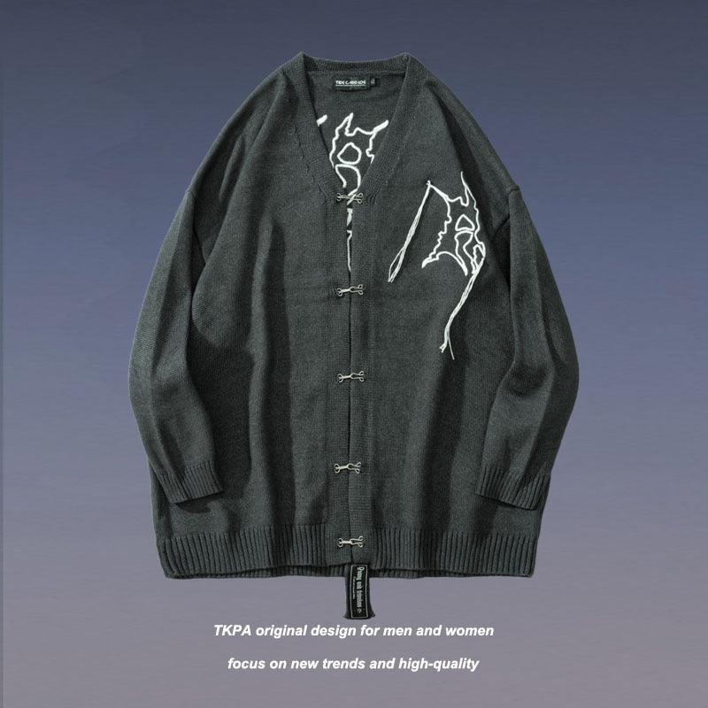 Green wool V-neck cardigan with button front, ribbed hem and cuffs, white graphic