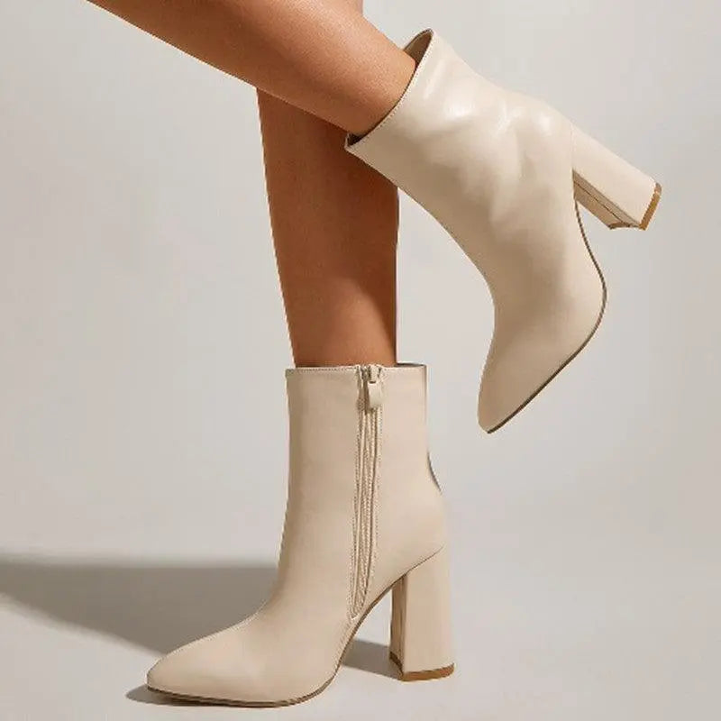 Cream high-heeled ankle boots with side zipper and pointed toe, chunky block heel