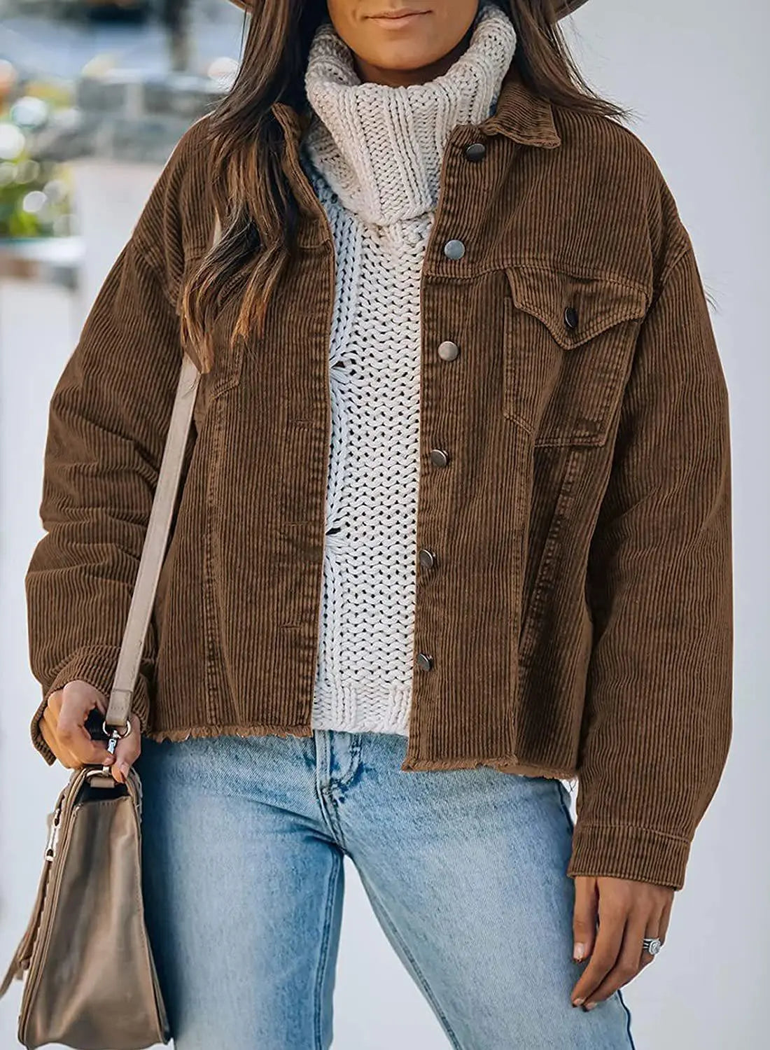 Women's corduroy jacket in coffee brown, button-front with chest pockets and snap cuffs.