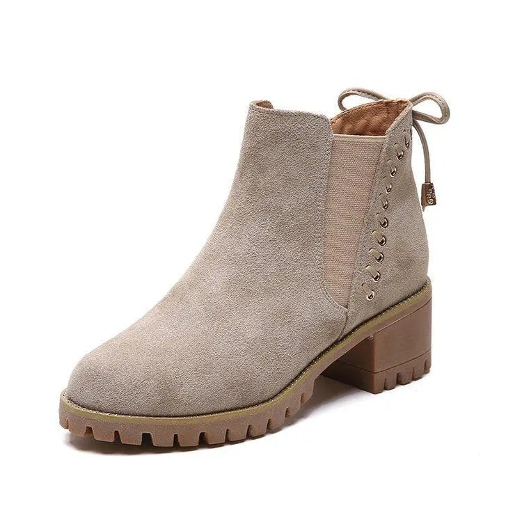 Beige suede ankle boots with thick block heel and lace-up side details