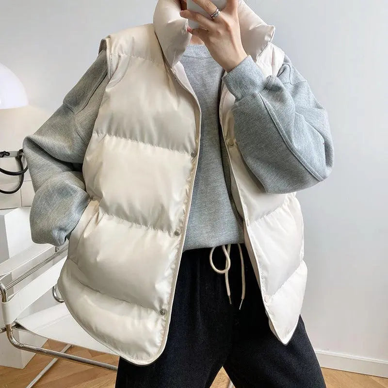 Cream padded sleeveless puffer vest with button front and stand collar