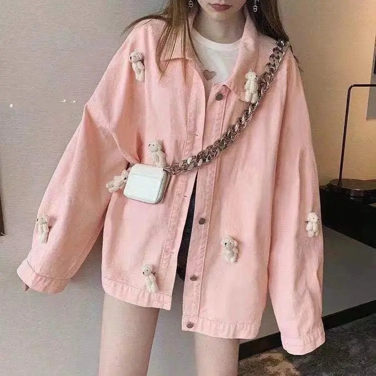 Pink work jacket with button front, long sleeves, and small teddy appliques