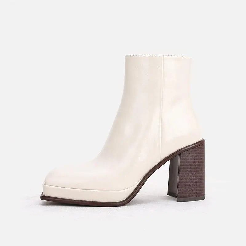 White leather ankle boots with square toe and chunky block heel, waterproof.