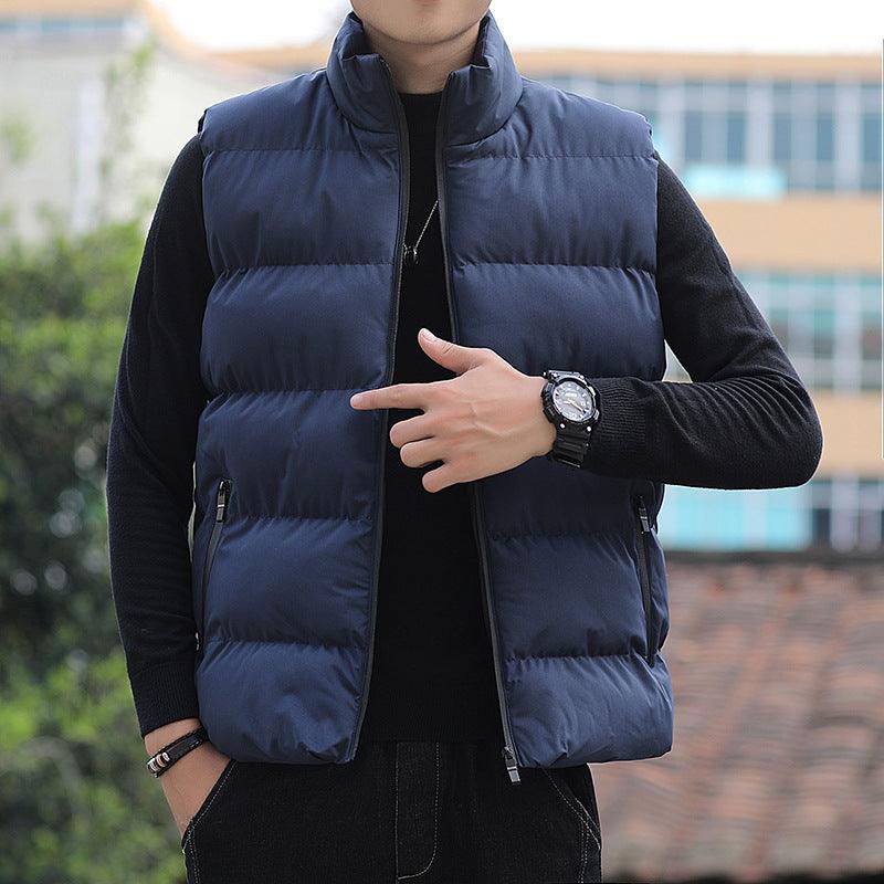 Blue padded sleeveless jacket vest with stand collar, front zipper, and side pockets