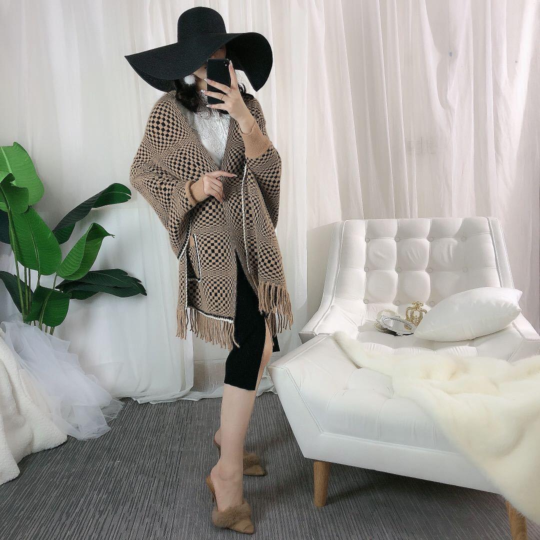 Faux mink velvet cape in brown-and-black check with front pockets and fringed hem